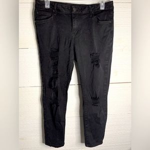 Petite Black Colored Jeans By a.n.a.  Size 10P.  Ripped designs.